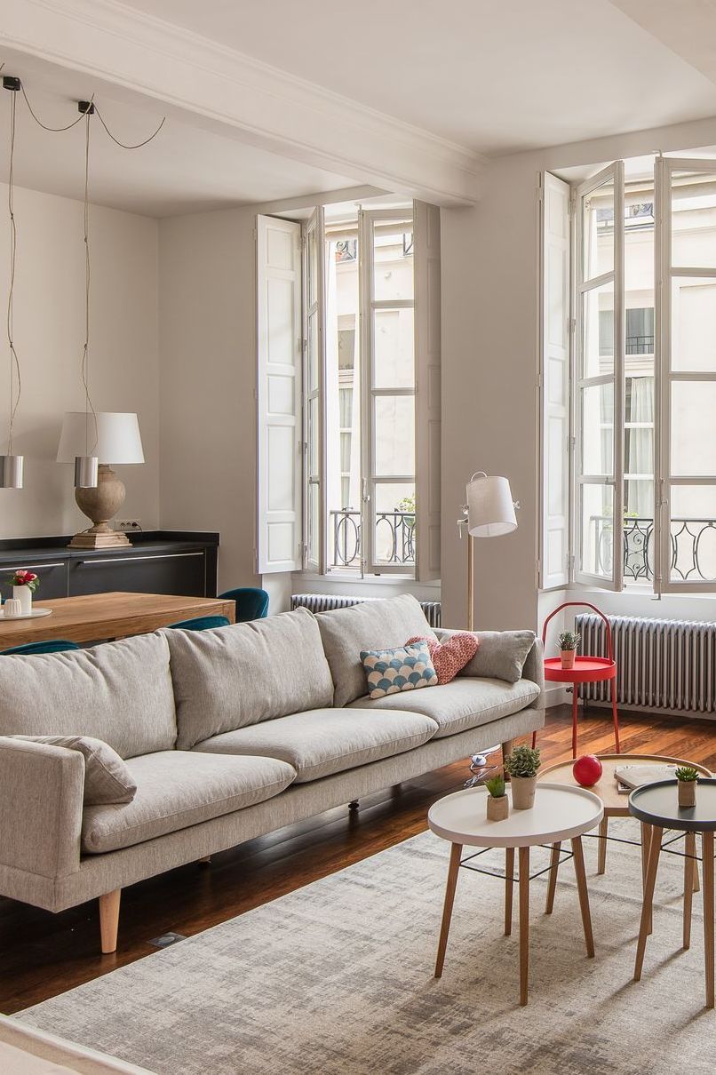 Parisian living room with gray sofa via CoteMaison