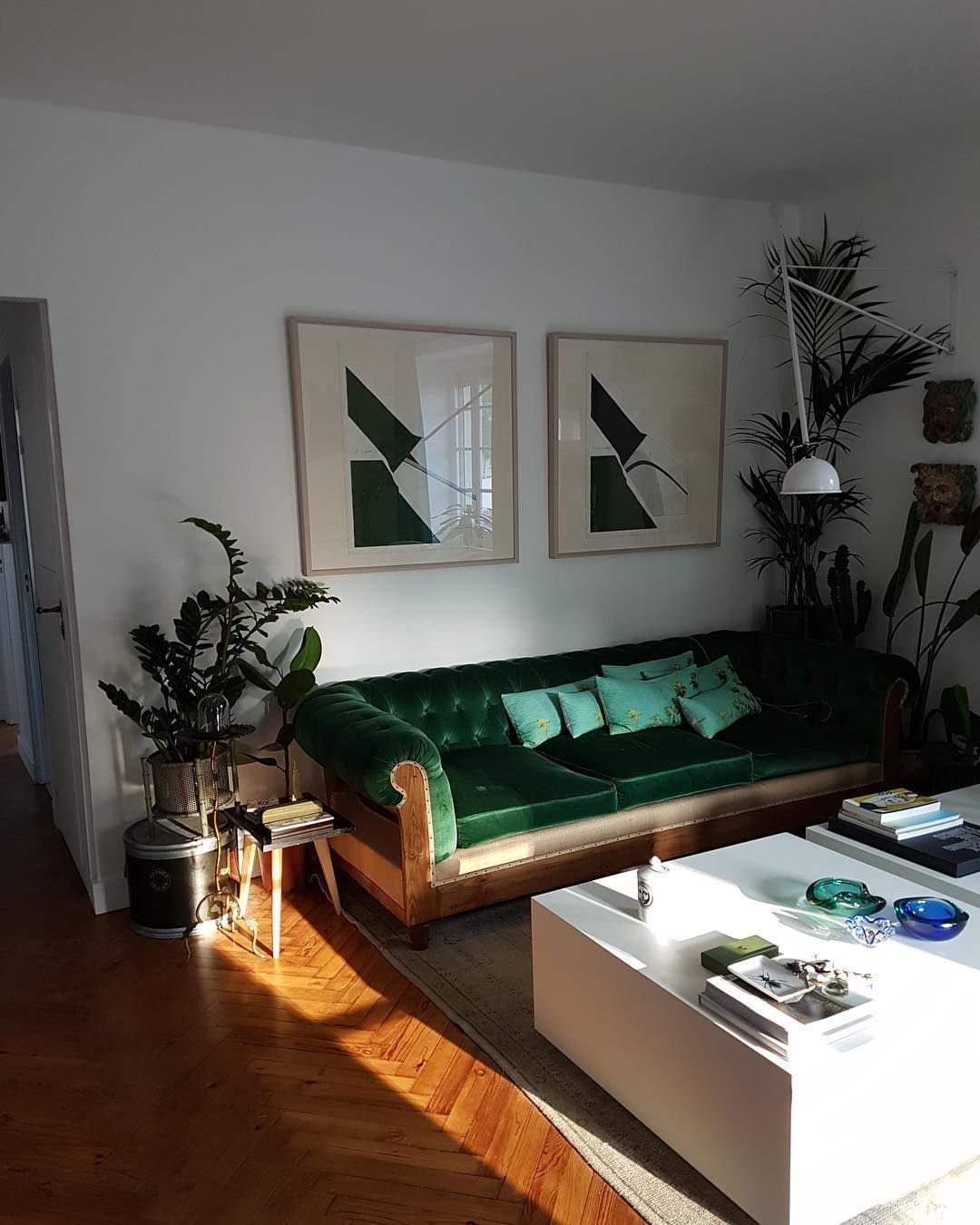 Parisian living room with green velvet sofa via @oliviergranet