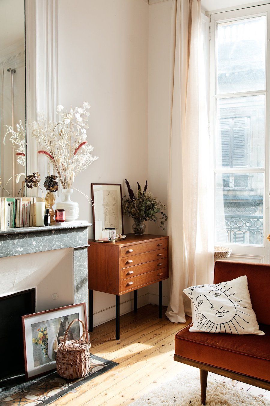 Parisian living room with mid-century cabinet storage via the socialite family Anne-Laure Mais