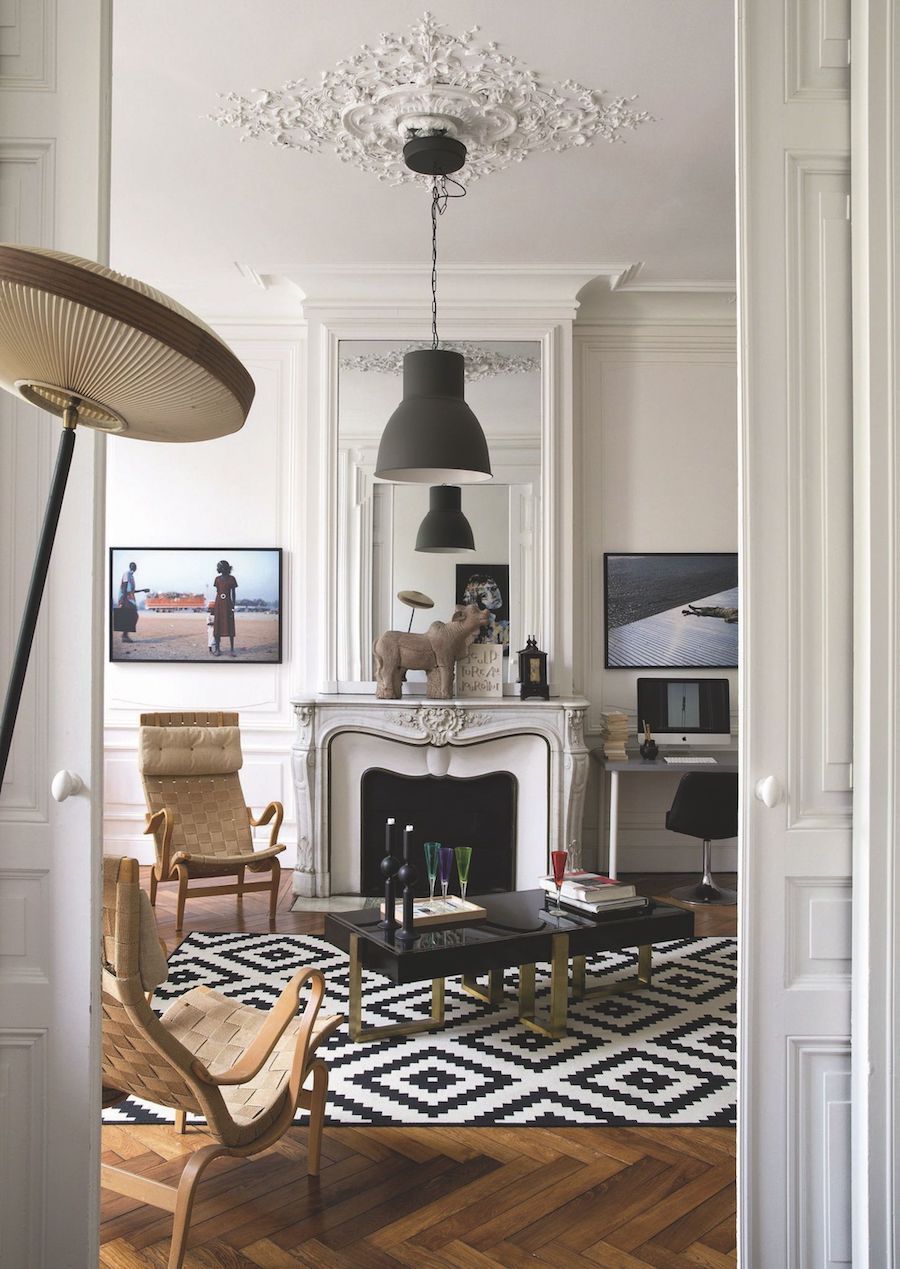 Parisian living room with modern black pendant light via CoteMaison Arnaud Caffort