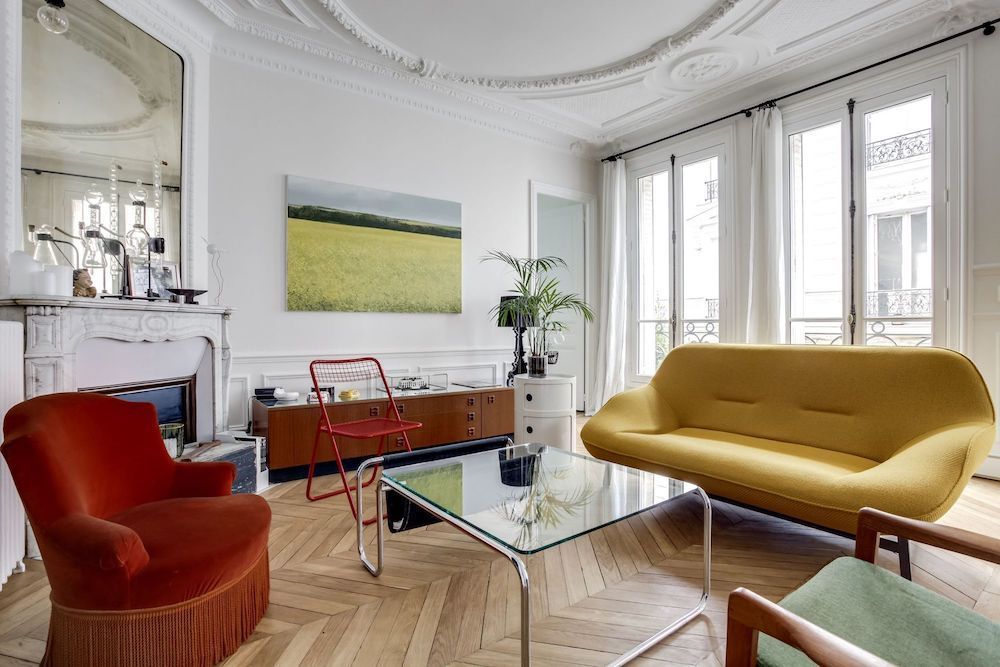 Parisian living room with modern mustard yellow sofa via CoteMaison Shoootin
