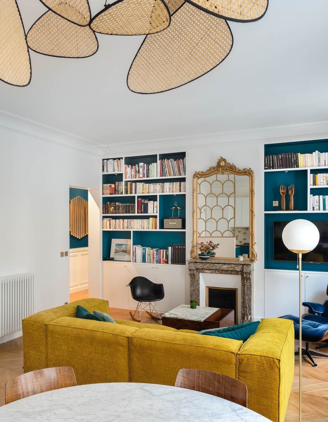 Parisian living room with mustard yellow sofa via Charlotte Fequet
