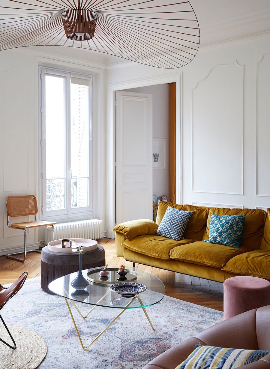 Parisian living room with mustard yellow sofa via Cup of Jo