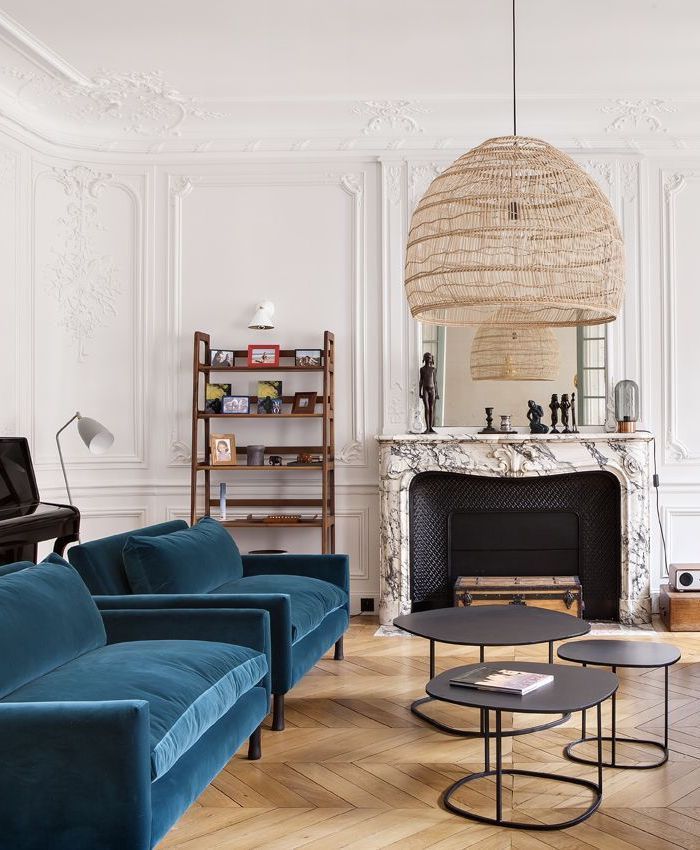 Parisian living room with turquoise accent chairs via Camille Hermand