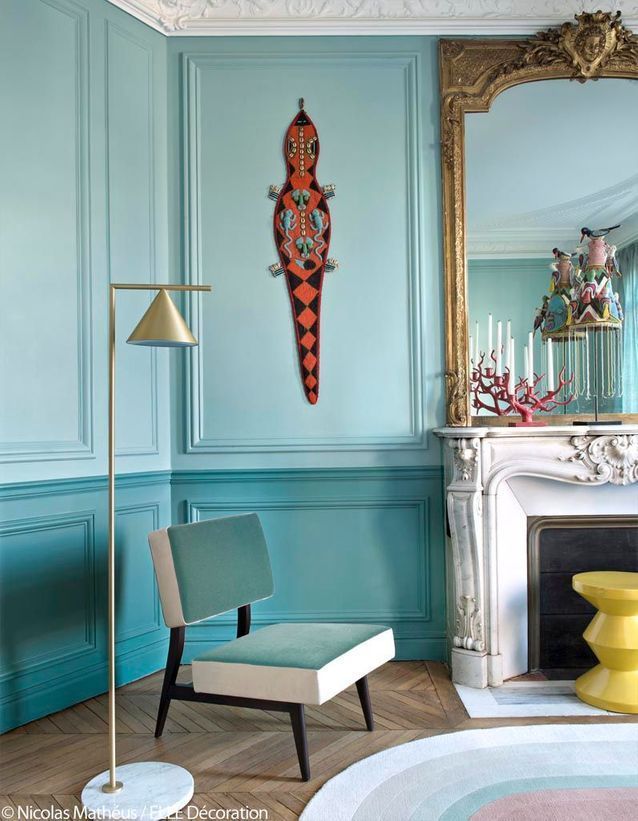 Parisian living room with turquoise walls haussmannien design via Elle