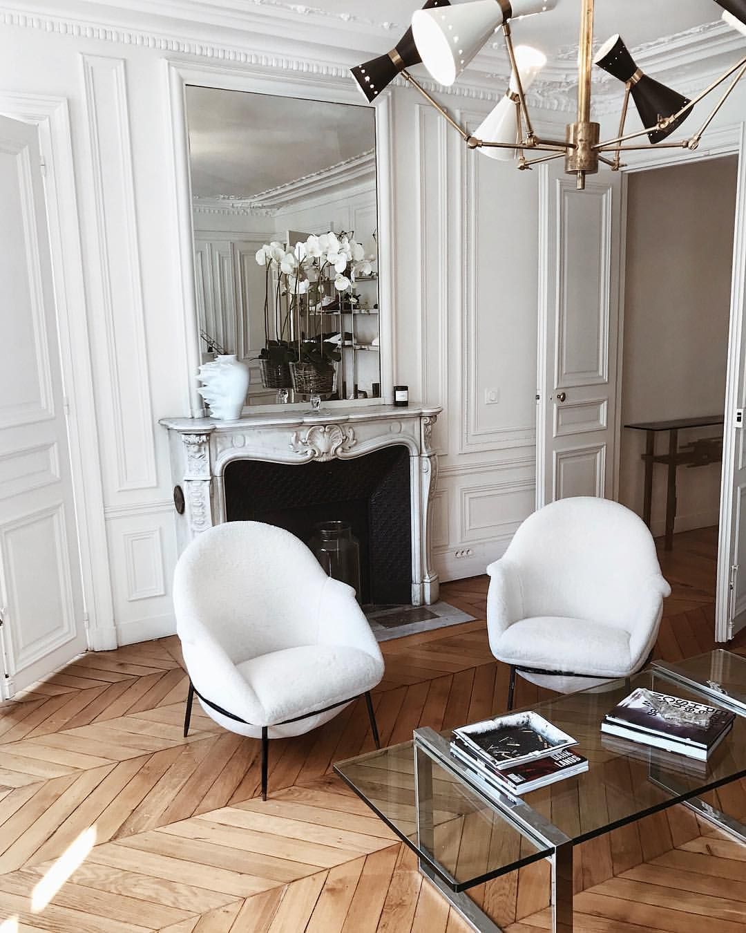 Parisian living room with two white chairs