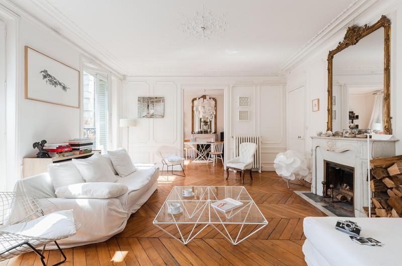 Parisian living room with white sofa via FrenchyFancy