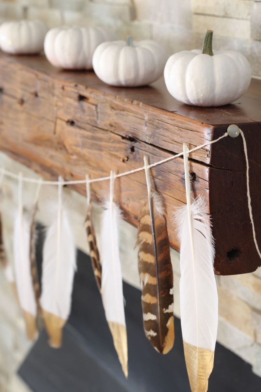 DIY Gold Tip Feather Garland via simplestylings