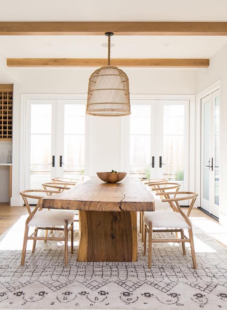 Rustic Wood Dining Table with Wishbone chairs and neutral rattan pendant light via @claytonbuilders