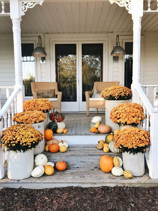 Fall front porch with Orange Mums and Gourds via Liz Marie