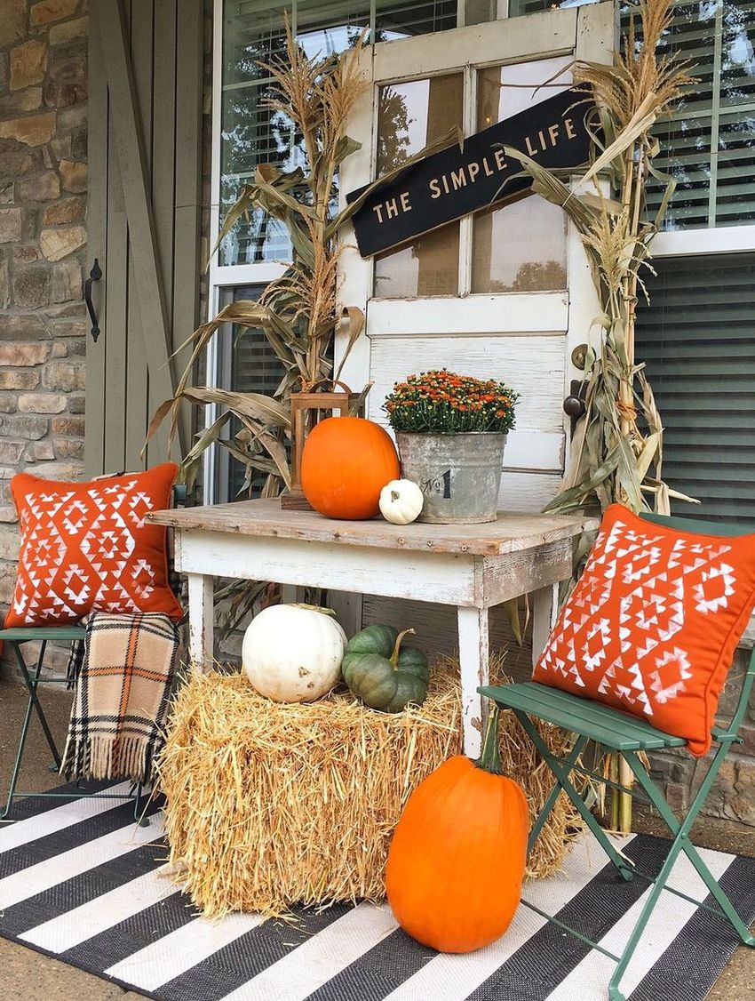 Fall front porch with old door as background vignette via yellowprairieinteriors