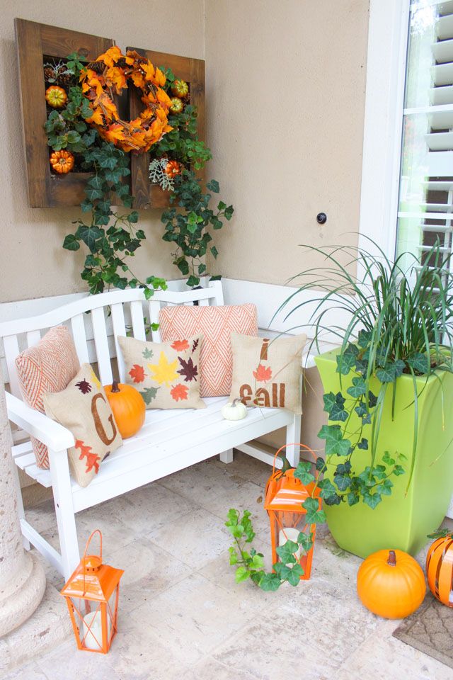 Fall front porch with orange lanterns via designimprovised