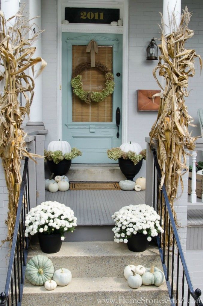 Fall front porch with white mums and green pumpkins via nestingwithgrace