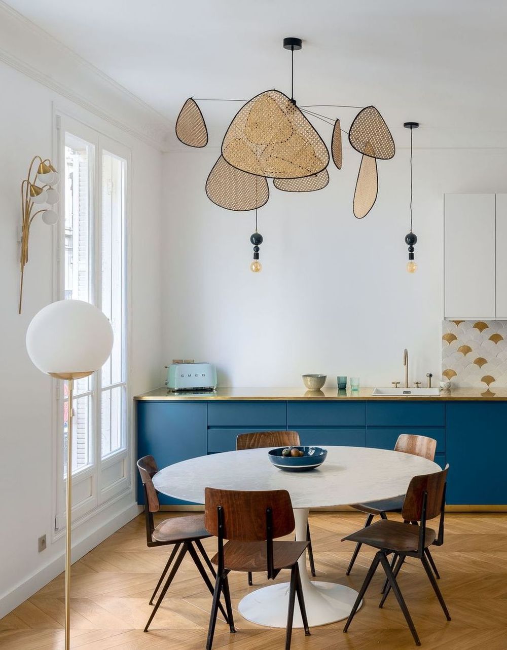 Small Parisian dining room decor with white marble dining table via Charlotte Fequet