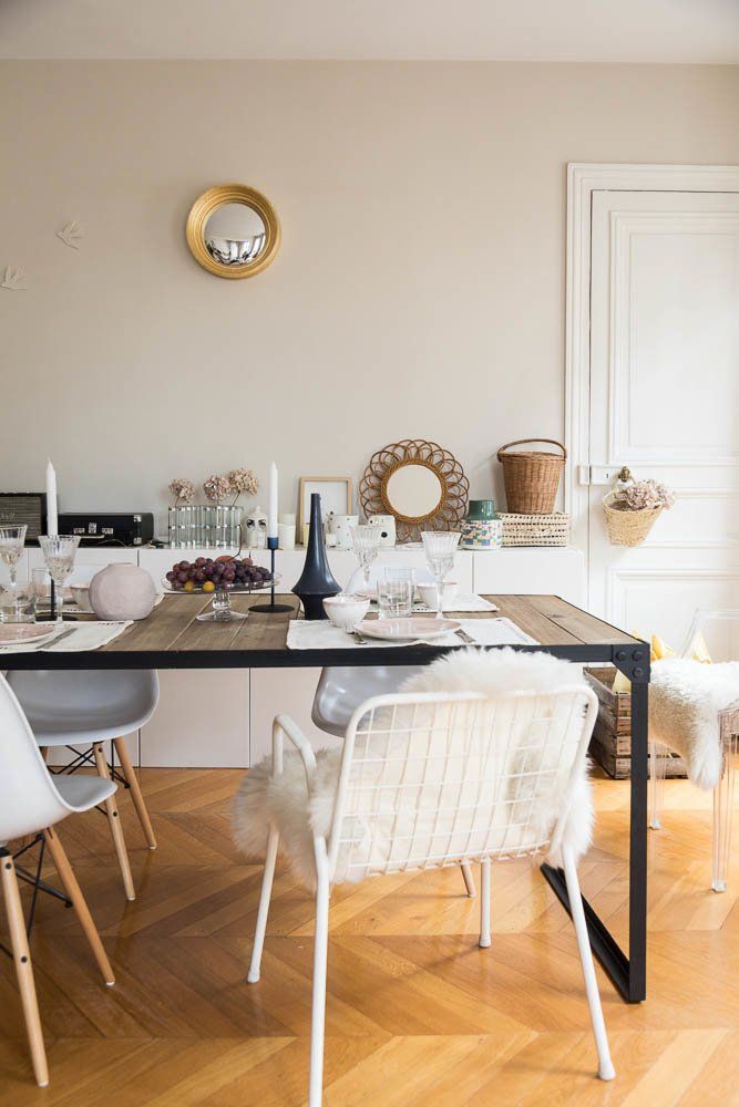 Parisian dining room with Bohemian decor, mismatched chairs and sheepskin seat cushions via The Socialite Family Audrey Borrego