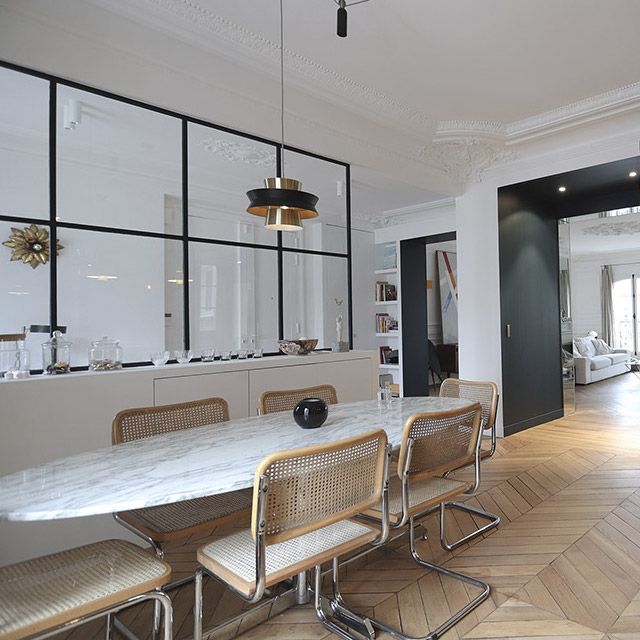 Parisian dining room design with Breuer chairs and oval marble dining table via miresparis