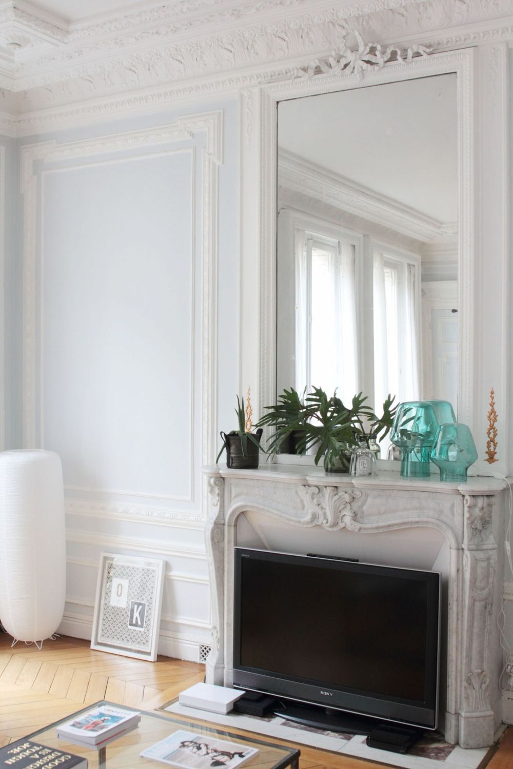 Parisian fireplace with clear Turquoise Vases via Hello-hello Vanessa Pouzet