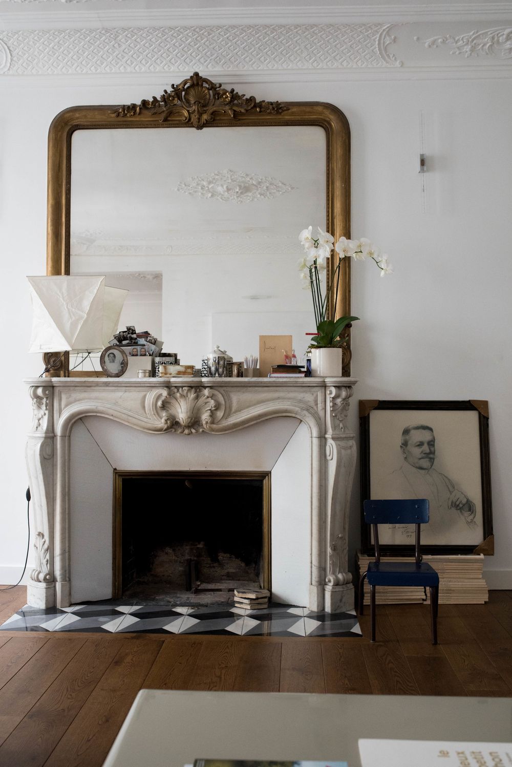 Parisian fireplace with Vintage family photos via houseofvalentina