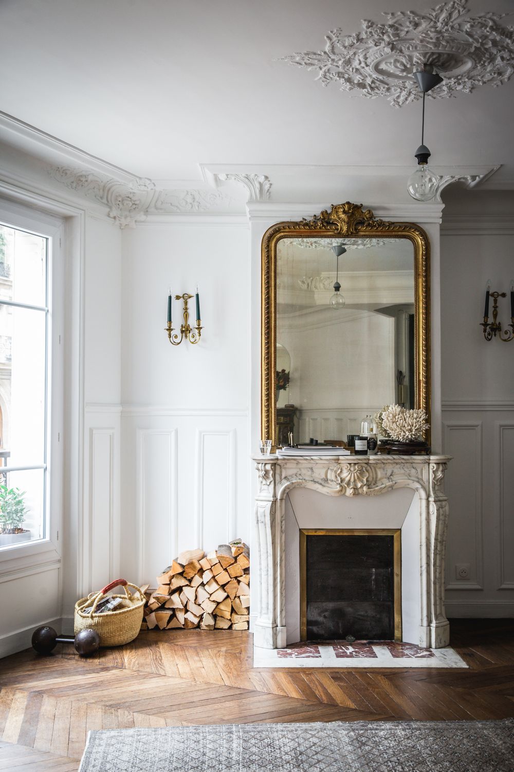 White marble Parisian Fireplace with gold mirror via AptLafayetteParis