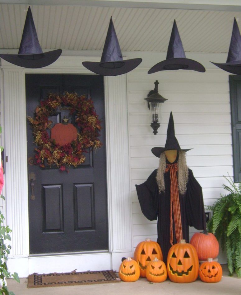 Witch at the front door Halloween porch decor idea