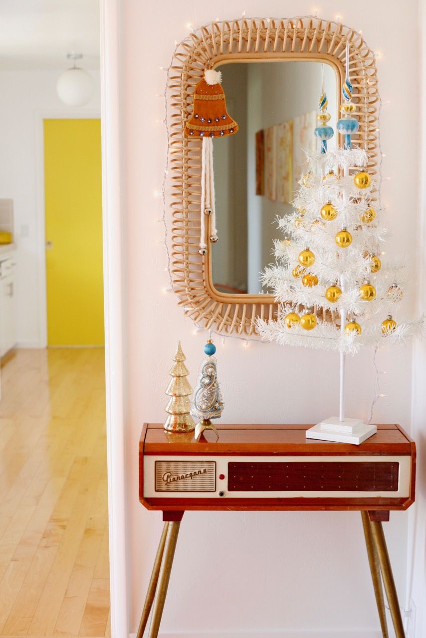 Mid-century White Aluminum Christmas tree on a side table via suburbanpop