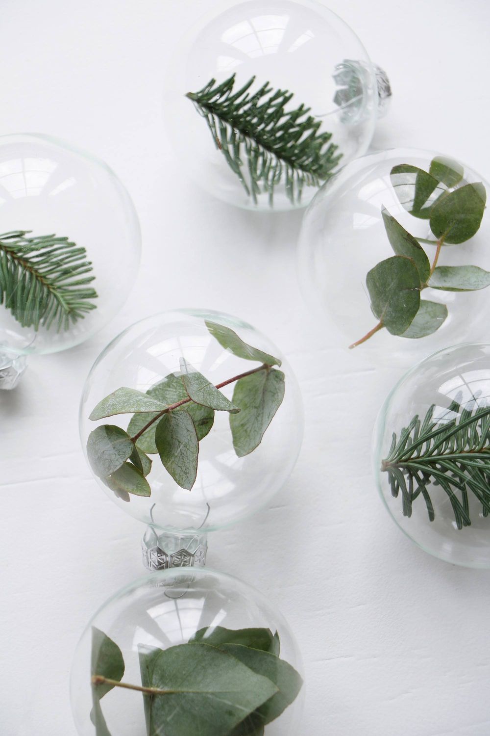 DIY Scandinavian Christmas Decorations Greenery inside glass ball ornaments