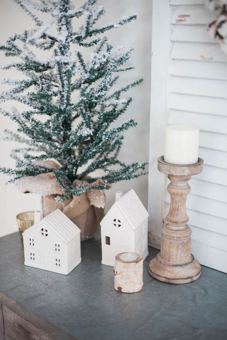 Evergreen tree and winter white houses via laurenmcbrideblog