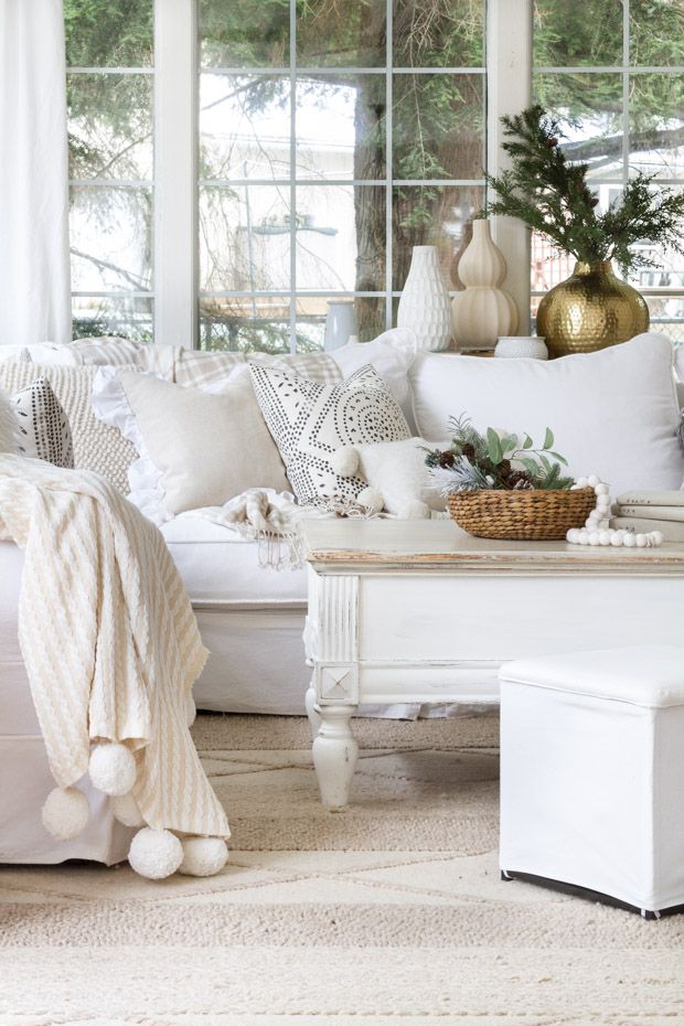 Neutral throw pillows on the sofa via zevyjoy