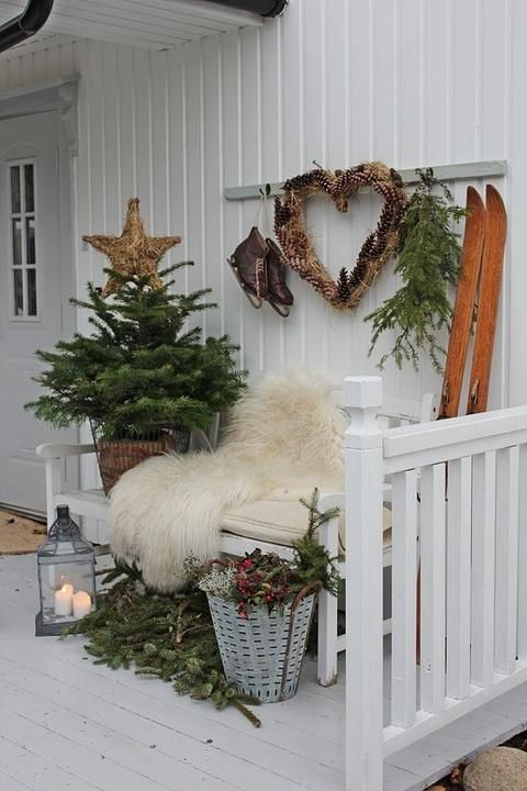 Scandi Christmas Entryway Bench Decor with faux fur throw blanket Pinecone Wreath and Wood Skis