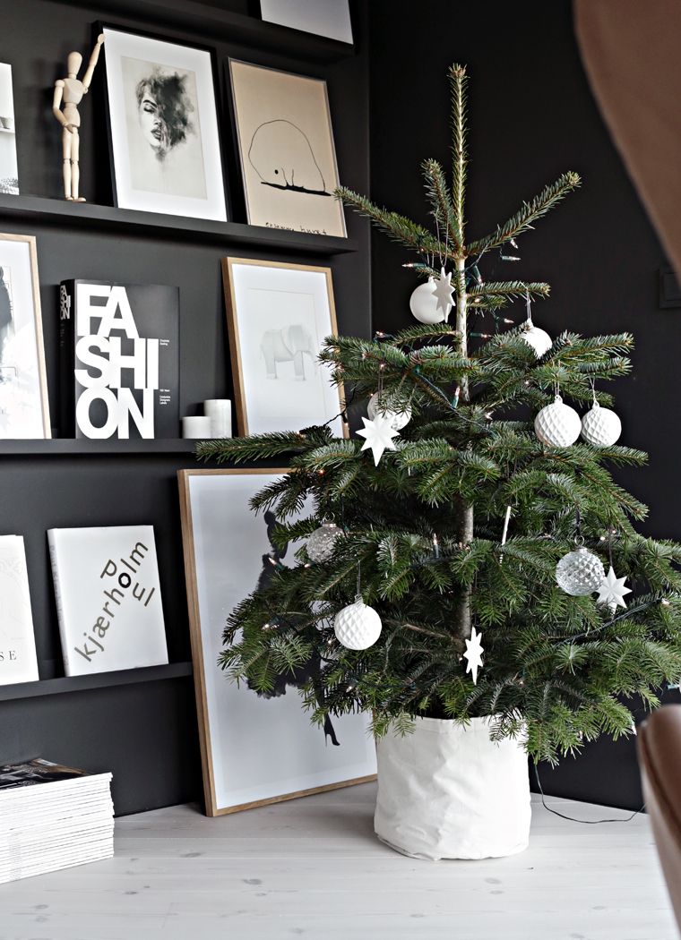 Small Scandinavian Christmas Tree against Black Wall via Nina Holst