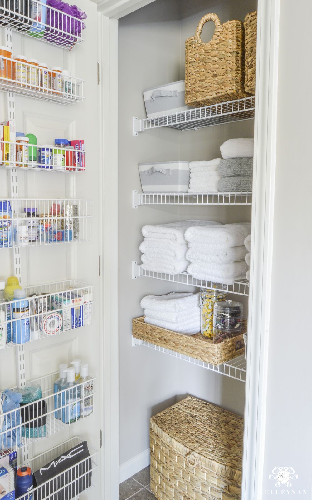 Bathroom Linen Closet Organization with White Shelves and Wicker Baskets via kelleynan