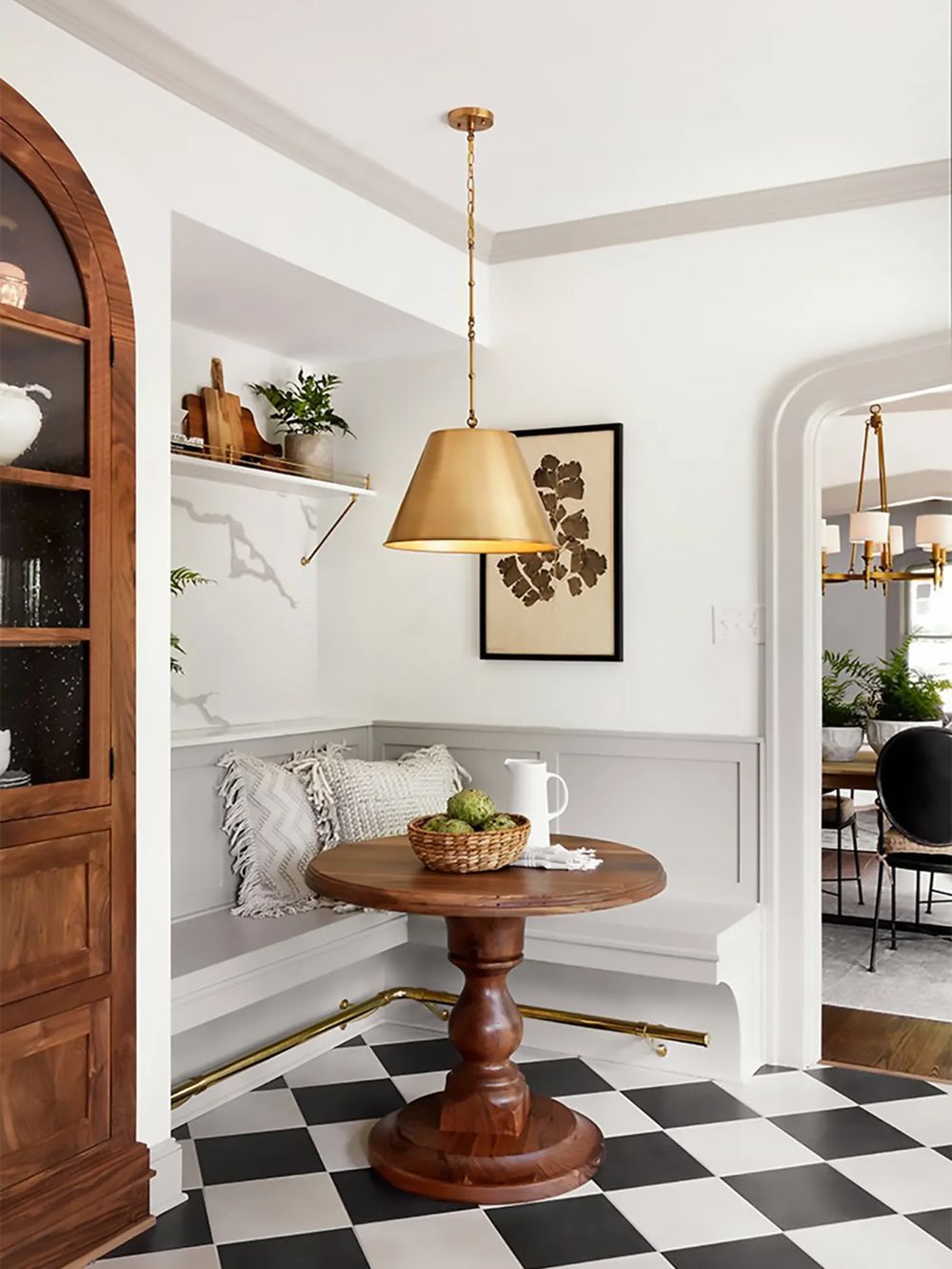 Fixer Upper Breakfast Nook with Black and White Checkered Tile Floor via Joanna Gaines