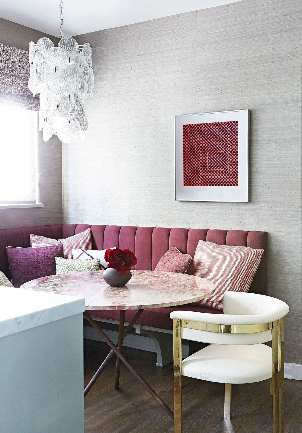 Pink channeled bench with Kelly Wearstler chair and vintage rose marble table via Christos Prevezanos