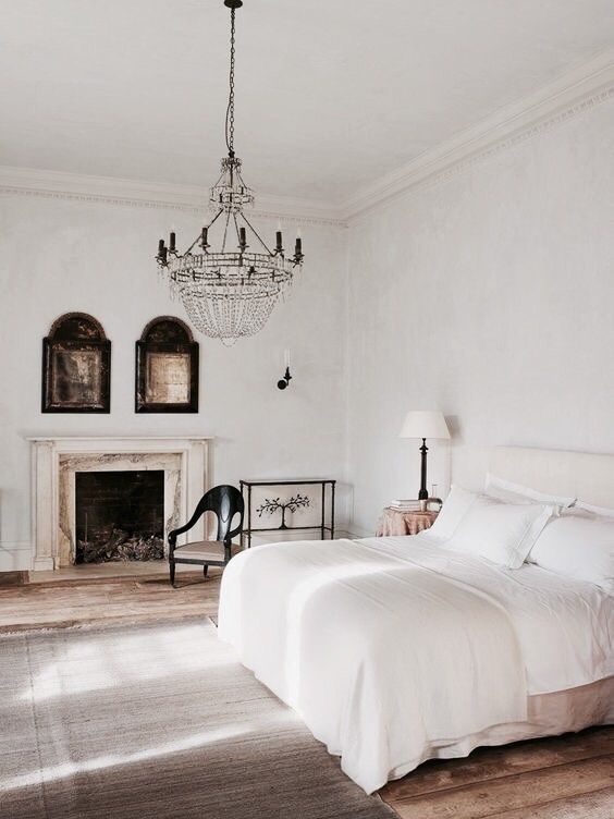 French Country Bedroom with Fireplace and Crystal Chandelier
