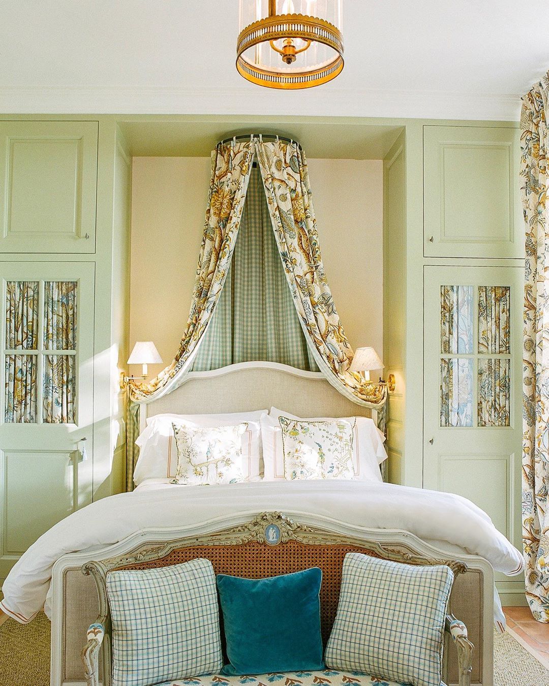 French country bedroom with Pastel Green Accent Wall via @provencepoiriers