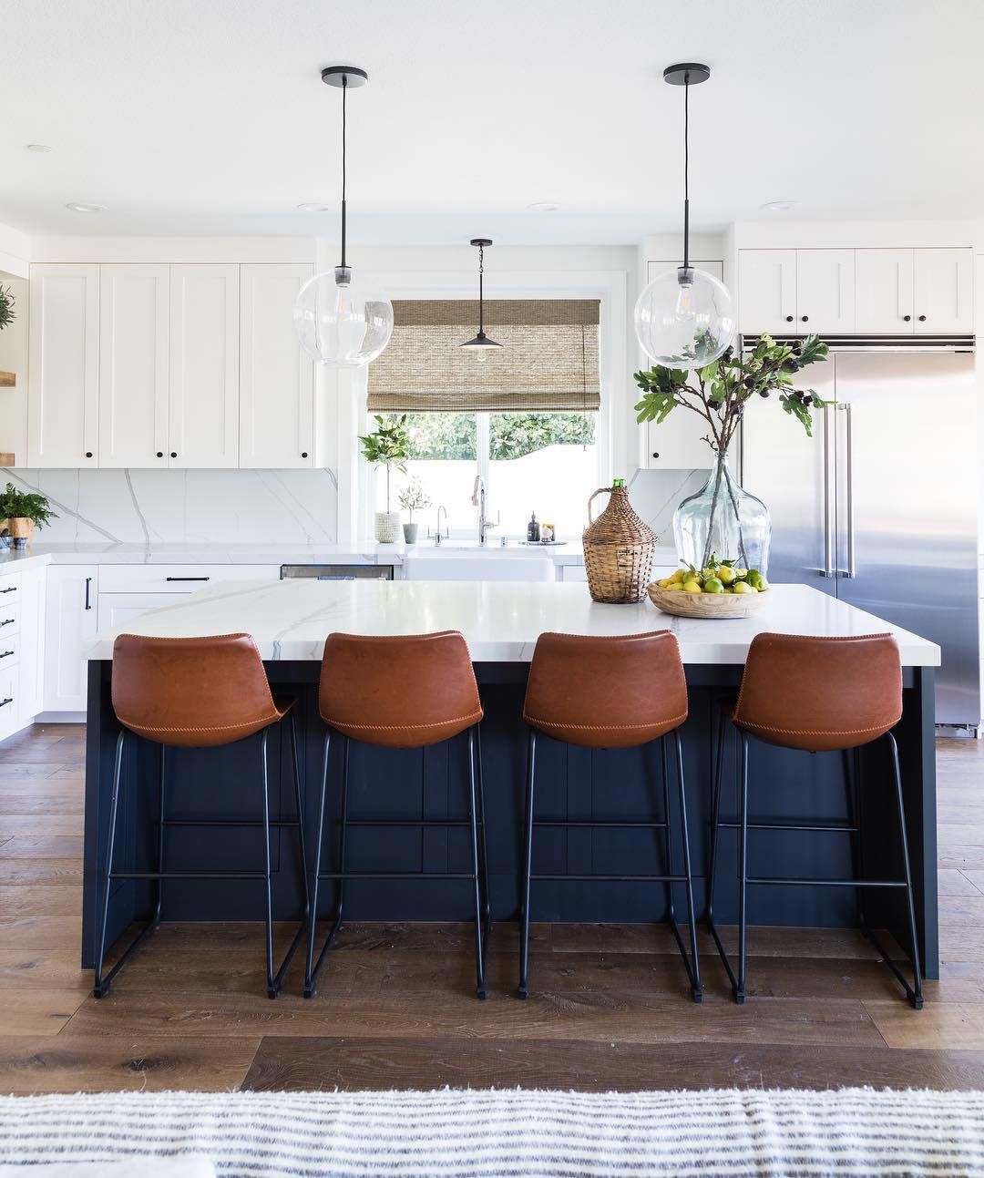 Brown Leather Counter Chairs in Kitchen via @puresaltinteriors