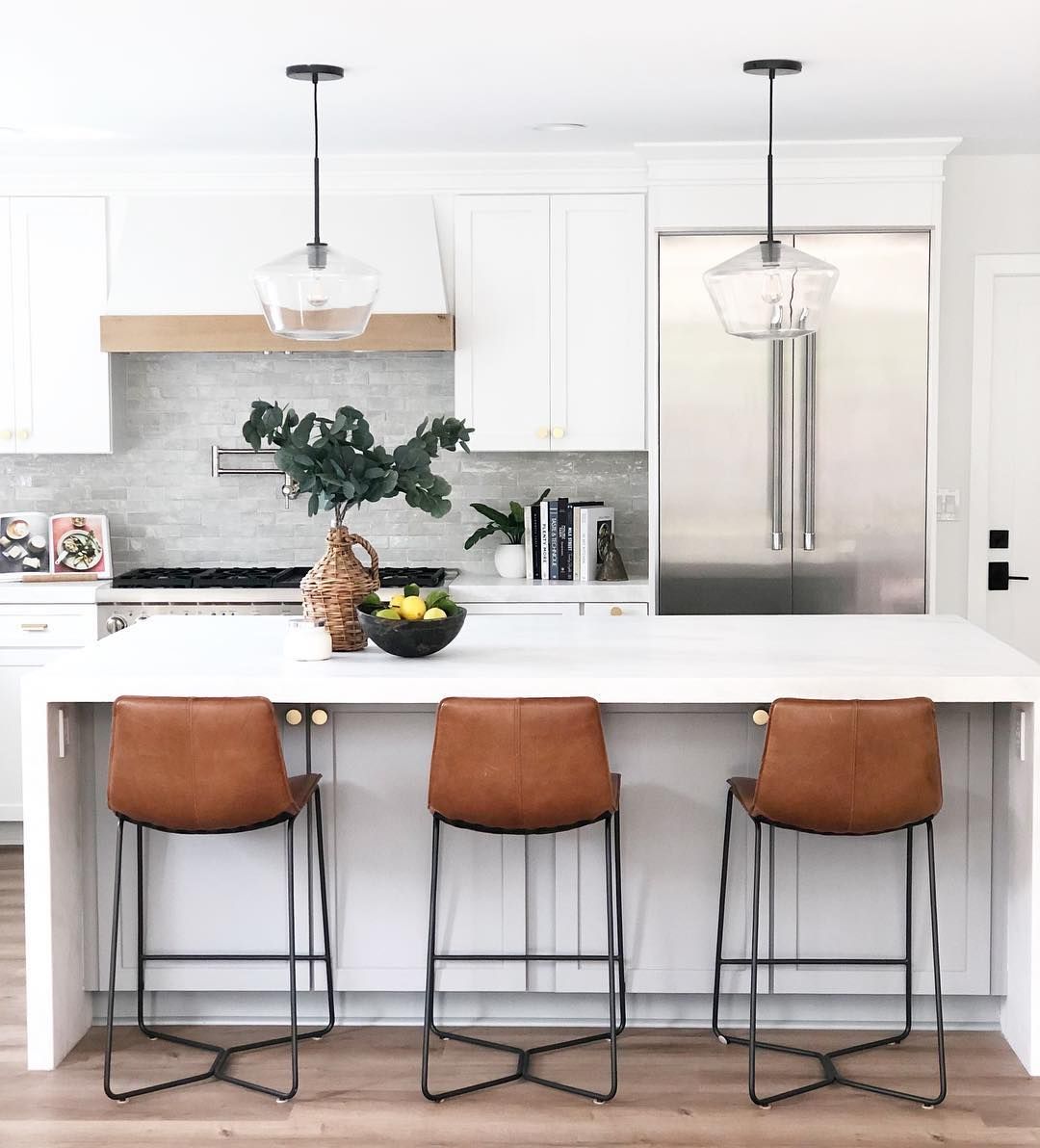 Brown Leather Counter Chairs around wood kitchen island via @puresaltinteriors