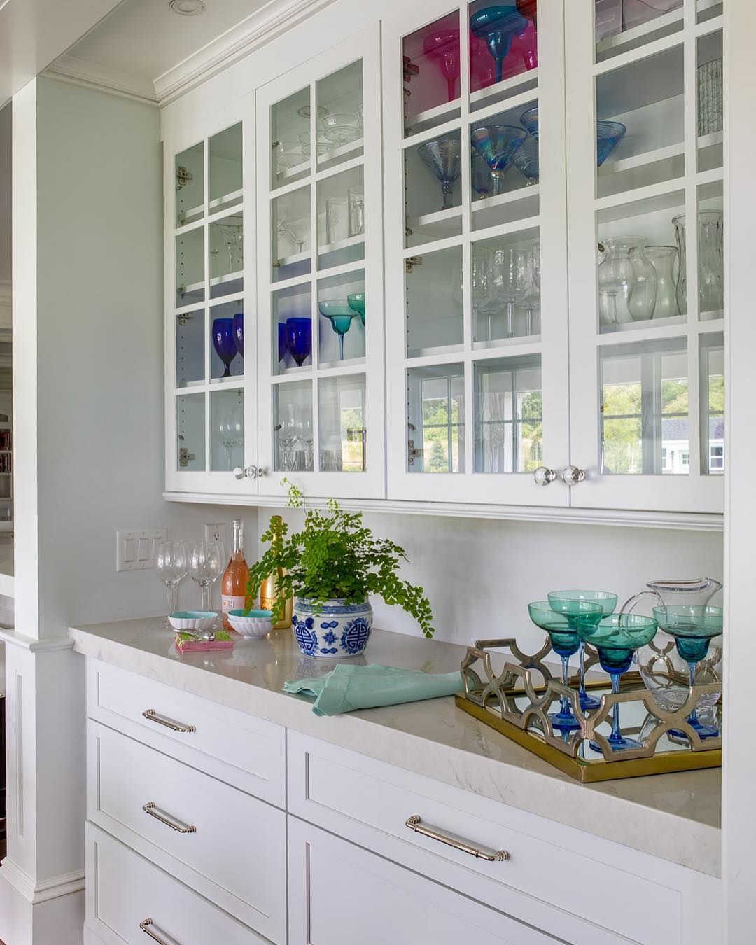 Coastal Kitchen with Glass Cabinets and Colorful Tableware via @digsdesignco