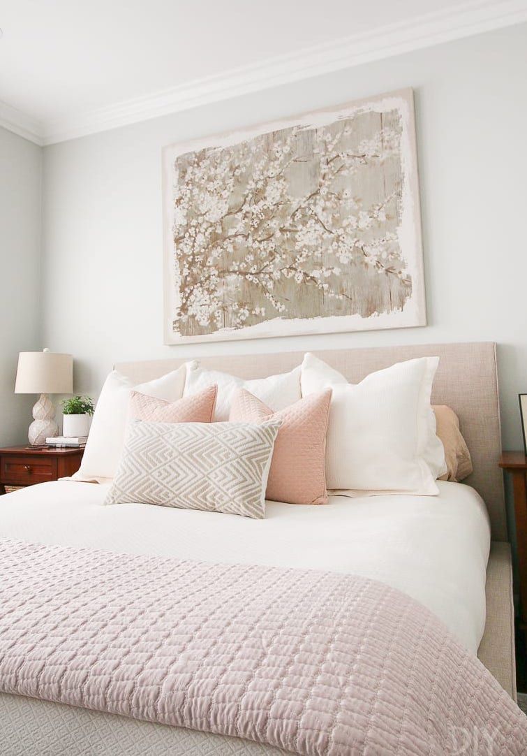 Feminine Throw Pillows on Bed with Beige Headboard