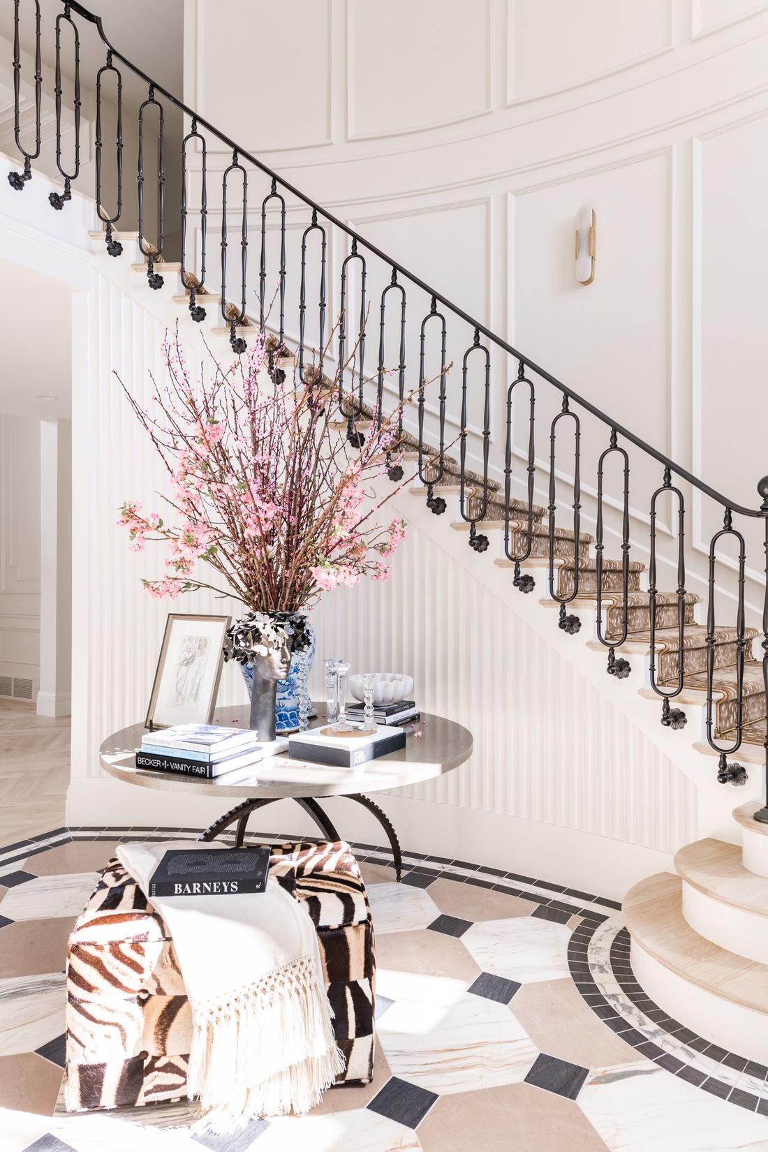 Glam Entryway with Marble Tiles and Black Iron Staircase via Rachel Parcell