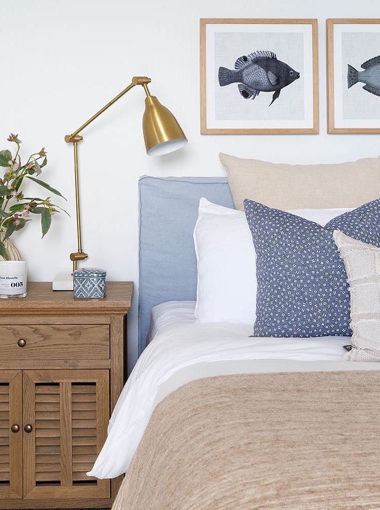 Brass task lamp on a nightstand in coastal bedroom via @donna_guyler_design