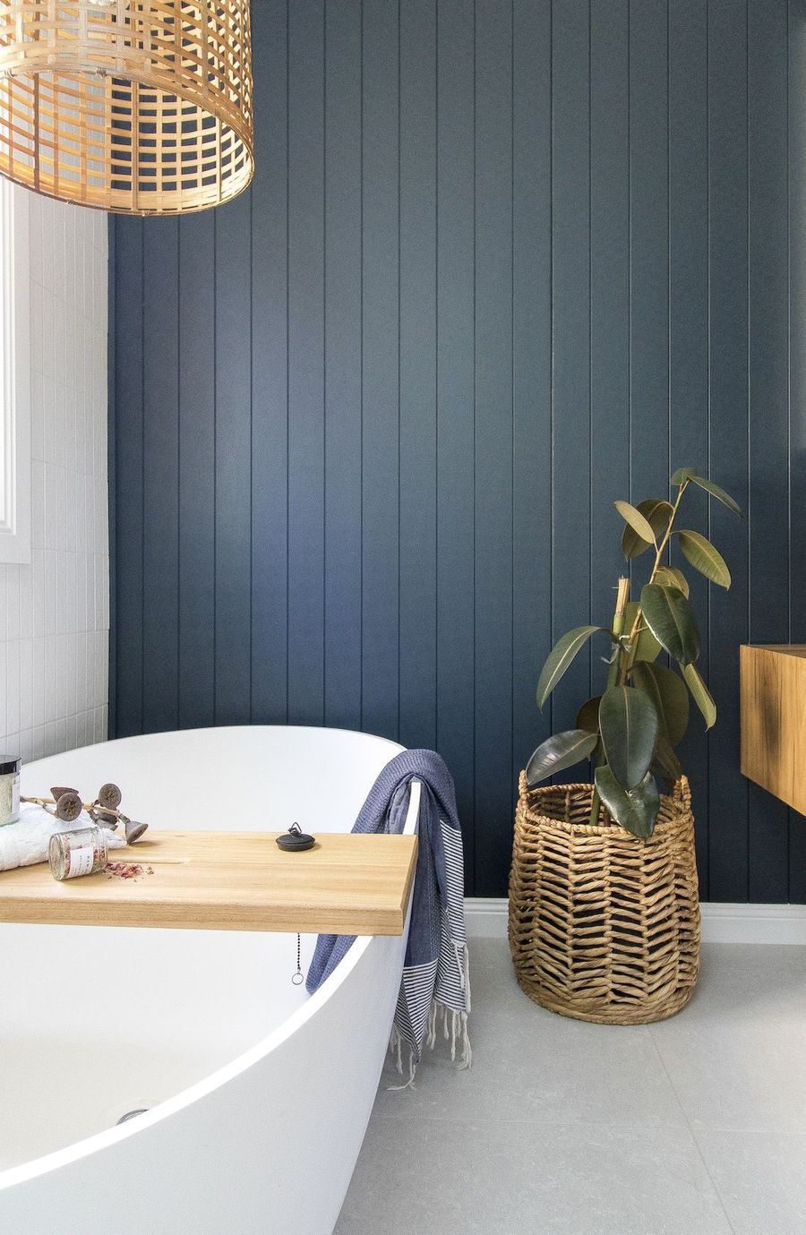 Coastal Bathroom with Navy Accent Wall via Anna from Moore Creative