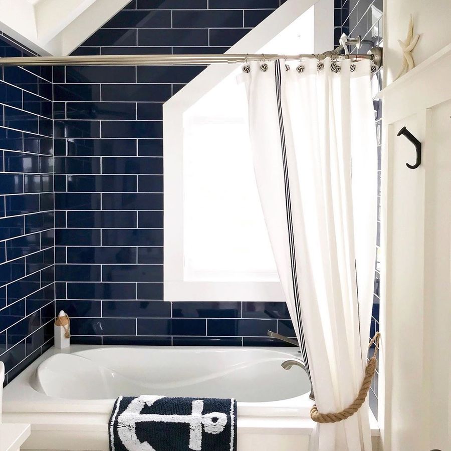 Coastal Bathroom with Navy Subway Tiles in Shower via @apopofprettyblog