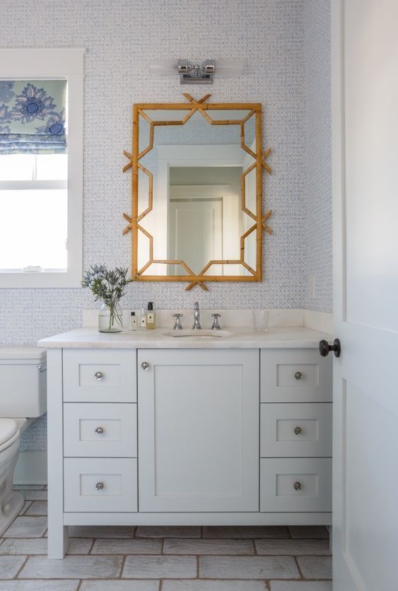Coastal Bathroom with Rattan Mirror via Lauren Leonard