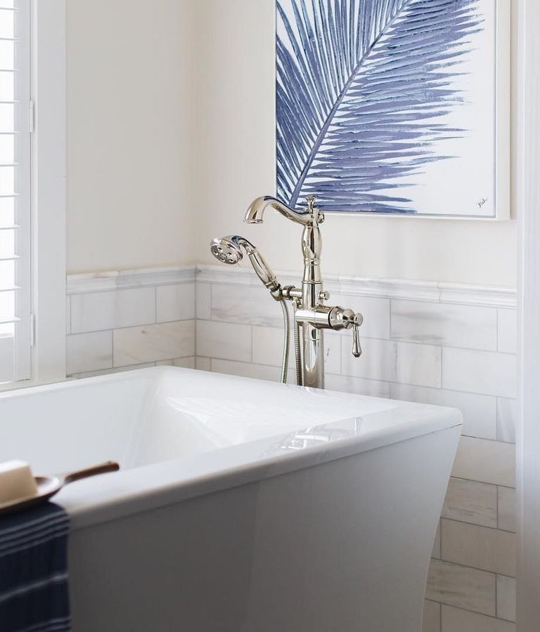 Coastal Bathroom with blue wall art via @timbertrailshomes