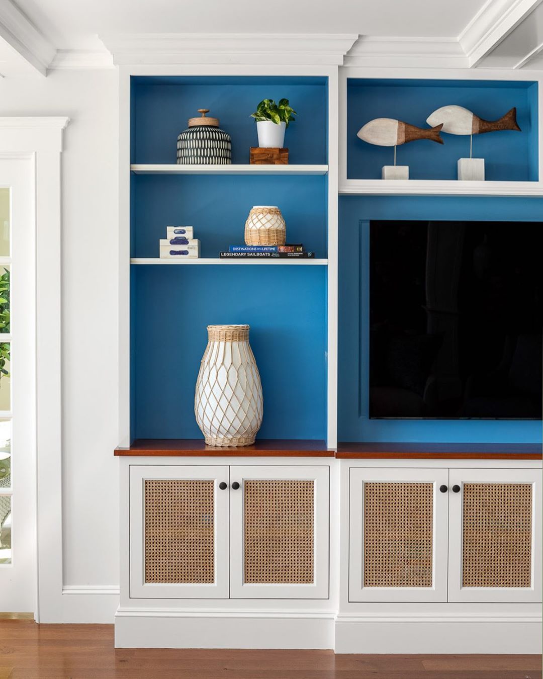 Coastal Living Room with Teal Paint behind Built-in Shelves via @digsdesignco