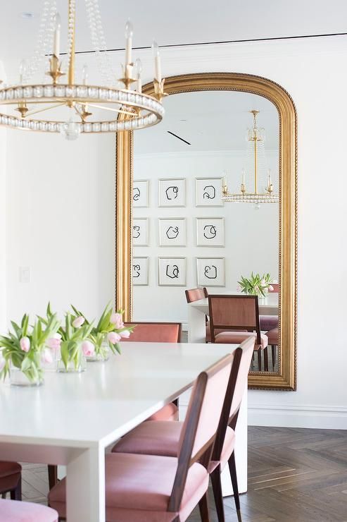 Glam Dining Room with Oversized Gold Wall Mirror via Shophouse Design