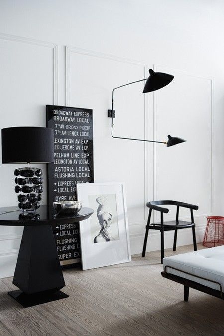 Minimalist Living Room with Black Wall Sconce