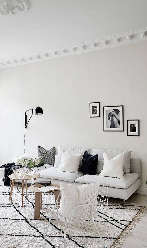 Minimalist Living Room with Gray Sofa via Stadshem