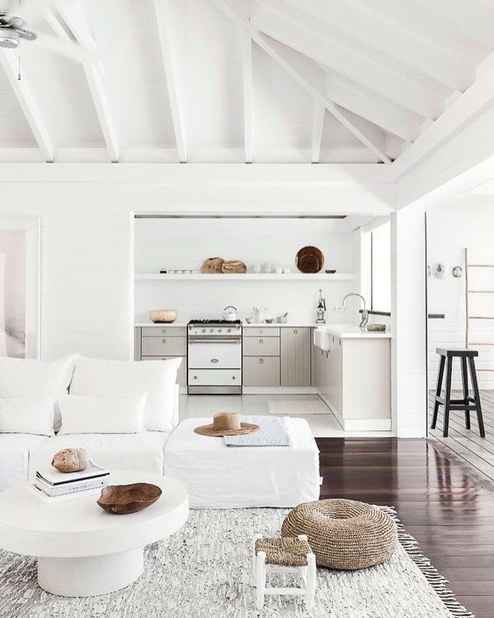 Minimalist Living Room with Lofted Ceiling via Elle France and Romain Ricard